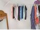 Organized closet with hanging clothes and mirror at 13478 Carrie Ave, Port Charlotte, FL 33953