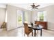 Casual dining area with wood table and chairs, view to backyard at 13478 Carrie Ave, Port Charlotte, FL 33953