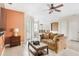 Living room with a view into kitchen and dining area at 13478 Carrie Ave, Port Charlotte, FL 33953