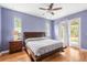 Spacious main bedroom with wood flooring and backyard access at 13478 Carrie Ave, Port Charlotte, FL 33953