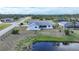 Aerial view of single-Gathering home near canal at 142 Broadmoor Ln, Rotonda West, FL 33947