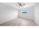 Bright bedroom with ceiling fan and vinyl plank flooring at 142 Broadmoor Ln, Rotonda West, FL 33947