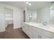 Double vanity bathroom with white cabinets and quartz countertops at 159 Colony Point Dr, Punta Gorda, FL 33950