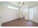 Spacious bedroom with wood-look floors and a door to a laundry room at 159 Colony Point Dr, Punta Gorda, FL 33950