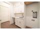 Laundry Room with white cabinets and countertop at 159 Colony Point Dr, Punta Gorda, FL 33950