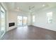 Living room with fireplace, sliding doors to a patio and lake view at 159 Colony Point Dr, Punta Gorda, FL 33950