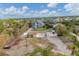 Aerial view of damaged houses and surrounding neighborhood at 1665 Manor Rd, Englewood, FL 34223