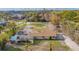 Aerial view of a single-story house with a pool and a large backyard at 1665 Manor Rd, Englewood, FL 34223