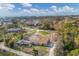 Aerial view of residential lot with single-Gathering home and pool at 1665 Manor Rd, Englewood, FL 34223