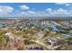 Aerial view of waterfront community with houses and waterways at 1665 Manor Rd, Englewood, FL 34223