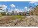 Single-story house exterior showcasing the back of the property at 1665 Manor Rd, Englewood, FL 34223