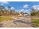 Single-story house exterior showcasing the side view at 1665 Manor Rd, Englewood, FL 34223