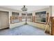 Unfinished sunroom with multiple windows and exposed walls at 1665 Manor Rd, Englewood, FL 34223