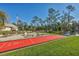 Large backyard with shuffleboard, putting green, and pergola at 17 Par View Pl, Rotonda West, FL 33947