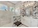 Bathroom with walk-in shower, patterned tile, and modern fixtures at 17 Par View Pl, Rotonda West, FL 33947