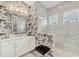 Spa-like bathroom with a walk-in shower and updated vanity at 17 Par View Pl, Rotonda West, FL 33947