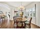 Bright dining area featuring a round table and wicker chairs, with views to the living room at 17 Par View Pl, Rotonda West, FL 33947