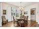 Charming dining room with a round wooden table and wicker chairs at 17 Par View Pl, Rotonda West, FL 33947