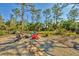 Relaxing fire pit area with stone pathway and comfortable seating at 17 Par View Pl, Rotonda West, FL 33947