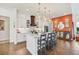 Modern white kitchen with an island, marble counters, and stainless steel appliances at 17 Par View Pl, Rotonda West, FL 33947