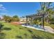 Relaxing pergola with seating area perfect for outdoor dining at 17 Par View Pl, Rotonda West, FL 33947