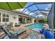 Expansive pool and patio area with covered lanai and comfortable seating at 17 Par View Pl, Rotonda West, FL 33947