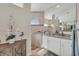 Elegant bathroom with walk-in shower, granite vanity, and large mirror at 17164 Canary Ln, Port Charlotte, FL 33948