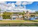 Covered boat lift and dock on a calm waterway at 17164 Canary Ln, Port Charlotte, FL 33948