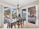 Bright dining room with sliding doors leading to the pool and patio at 17164 Canary Ln, Port Charlotte, FL 33948