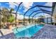 Relaxing screened pool and patio with canal views at 17164 Canary Ln, Port Charlotte, FL 33948