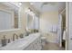 Bathroom with double vanity and marble countertop at 185 Cougar Way, Rotonda West, FL 33947