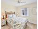 Bedroom with queen bed and beach themed decor at 185 Cougar Way, Rotonda West, FL 33947