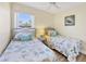 Twin bedroom with beach themed bedding and decor at 185 Cougar Way, Rotonda West, FL 33947