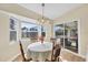 Charming dining area with view of the pool and backyard at 185 Cougar Way, Rotonda West, FL 33947