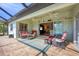 Spacious patio with seating and access to pool at 185 Cougar Way, Rotonda West, FL 33947