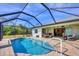 Refreshing pool with screened enclosure and patio at 185 Cougar Way, Rotonda West, FL 33947