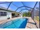 Enjoy this lovely screened pool and patio area at 185 Cougar Way, Rotonda West, FL 33947