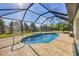 Relaxing screened-in pool with spacious patio at 185 Cougar Way, Rotonda West, FL 33947