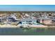 Aerial view of a waterfront home with a private pool and boat dock at 1900 Illinois Ave, Englewood, FL 34224