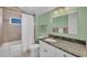 Bathroom with shower/tub combo and granite countertop at 1900 Illinois Ave, Englewood, FL 34224