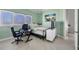 Bright bedroom with a workspace and large windows at 1900 Illinois Ave, Englewood, FL 34224