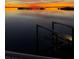 Empty boat lift at sunset over calm water at 1900 Illinois Ave, Englewood, FL 34224