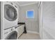 Well-appointed laundry room with washer, dryer, and ample storage at 1900 Illinois Ave, Englewood, FL 34224