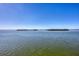 Stunning view of calm water with small islands under a clear sky at 1900 Illinois Ave, Englewood, FL 34224