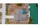 Bird's-eye view of house, pool, and canal at 1954 Arkansas Ave, Englewood, FL 34224