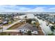 Aerial view showing home's location on a canal with water access at 1954 Arkansas Ave, Englewood, FL 34224