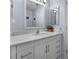 Bathroom featuring a white vanity with marble countertop at 1954 Arkansas Ave, Englewood, FL 34224