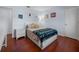 Bright bedroom with a comfortable bed and wood floors at 1954 Arkansas Ave, Englewood, FL 34224