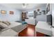 Bedroom with wood floors, white dresser, and window with view at 1954 Arkansas Ave, Englewood, FL 34224