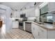 Modern kitchen with stainless steel appliances and white shaker cabinets at 1954 Arkansas Ave, Englewood, FL 34224